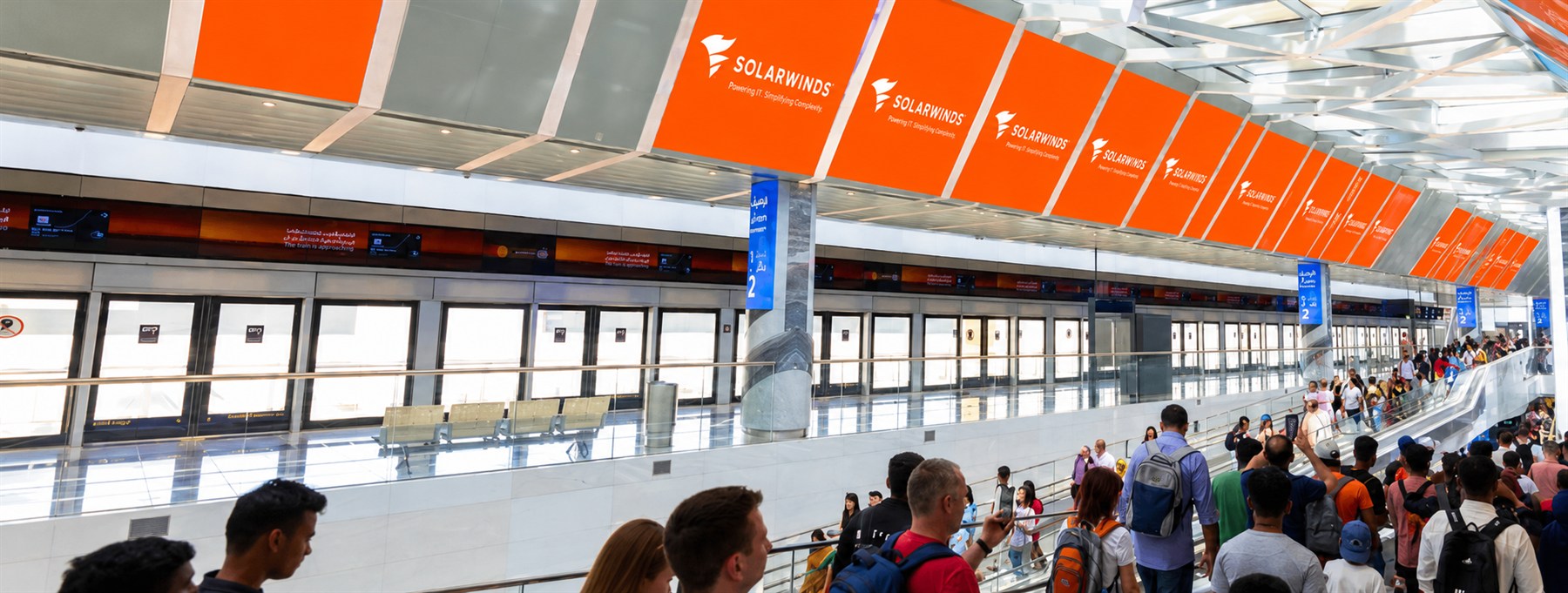 SolarWinds skylight banner run above the platform screen doors at Expo City metro station